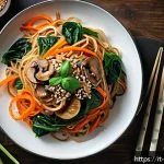 Home 18 한식 잡채 레시피 - A vibrant and authentic japchae dish served on a large rustic ceramic plate, featuring translucent s...